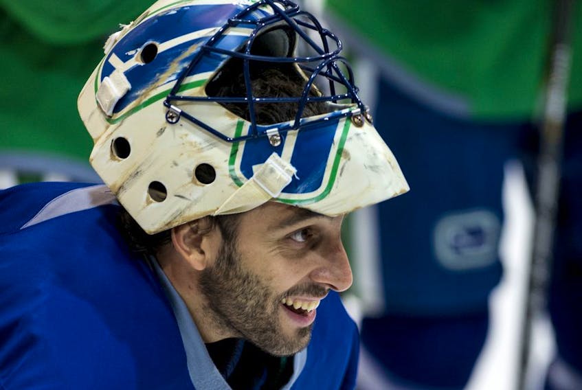  Star goalie Roberto Luongo is all smiles at a Canucks practice in 2013.