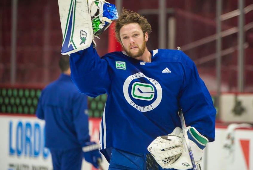 Goalie Thatcher Demko takes a breather during Canucks practice at Rogers Arena on Oct. 9, 2019.