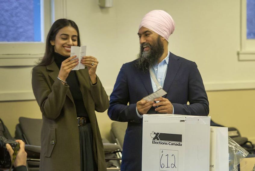  Gurkiran double-checks her ballot with husband NDP Leader Jagmeet Singh vote at Burnaby Neighbourhood House in Burnaby, BC, October 13, 2019.