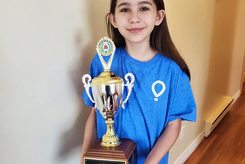 Point Leamington's Kelly Earle is hoping Health Canada will give the go ahead to a new drug called Trikafta intended to help with the strain of cystic fibrosis her 13-year-old daughter Sammi-Jo James struggles with. Here, James is shown with her trophy for being named the 2019 Janeway Children's Miracle Network Champion. CONTRIBUTED