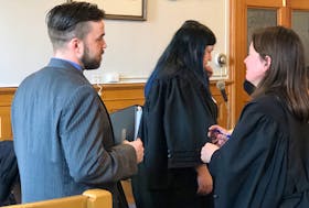 Philip Butler speaks to Karen Rehner, one of his defence lawyers, during a break in his trial in Newfoundland and Labrador Supreme Court Tuesday. Tara Bradbury/The Telegram