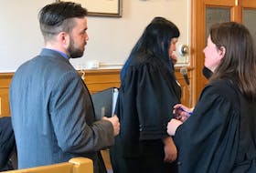 Philip Butler speaks to Karen Rehner, one of his defence lawyers, during a break in his trial in Newfoundland and Labrador Supreme Court Tuesday. Tara Bradbury/The Telegram