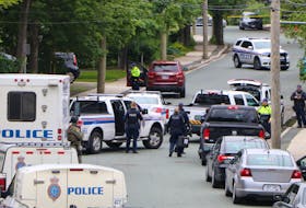 Members of the RNC’s forensics unit attend the scene of a possible homicide on Craigmillar Avenue in St. John’s Sunday morning. Glen Whiffen/The Telegram
