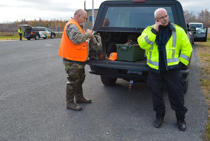 Sgt. Barry Morrison, left, of the Cape Breton Regional Police Service street crime unit, and Sgt. Jackie Burke, major crime unit, at the scene of a major search in a wooded area by the Glace Bay and Area Water Treatment Plant off Tower Road, Monday. The search was wrapped up Tuesday afternoon, which police described as part of an ongoing investigation. Sharon Montgomery-Dupe/Cape Breton Post