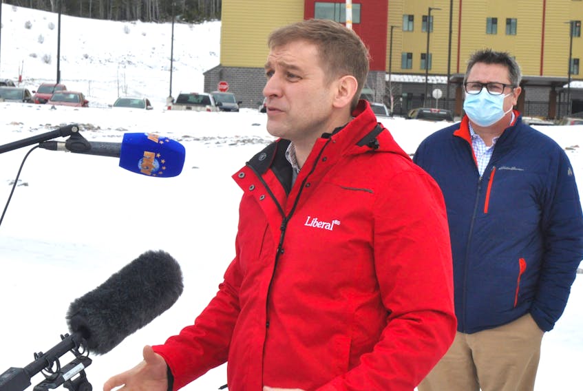 Premier Andrew Furey takes questions Monday outside the Western Long Term Care Home in Corner Brook. Standing behind him is Dr. Ed Mercer, Western Health's regional chief of medicinal imaging. STEPHEN ROBERTS/SALTWIRE NETWORK