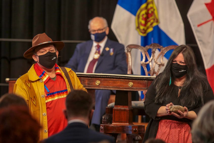 Elder Todd Labrador and Melissa Labrador perform a smudging ceremony during the swearing-in of Premier Iain Rankin and the cabinet on Tuesday. CONTRIBUTED 