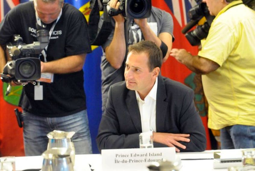 Premier Robert Ghiz prepares for the start of the premiers meeting with First Nations delegates in Charlottetown Tuesday.