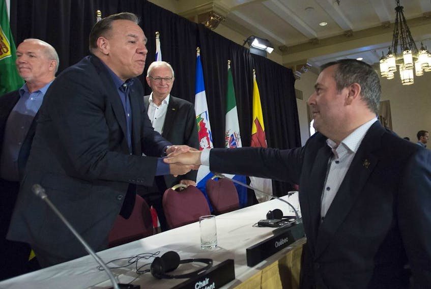 Alberta Premier Jason Kenney shakes hands with Quebec Premier Francois Legault following a closing news conference at a meeting of Canada's Premiers in Saskatoon, Sask. Thursday, July 11, 2019.