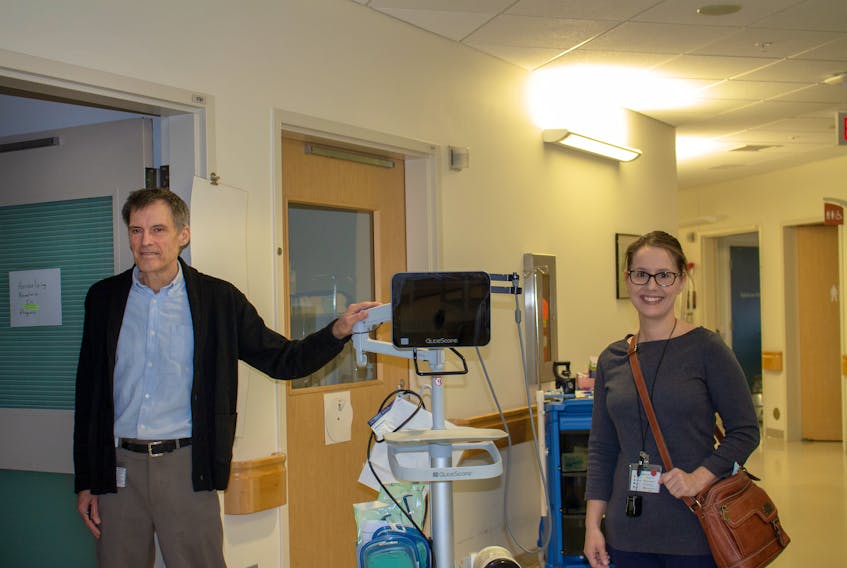Internal Medicine Physicians Dr. Michael Irvine and Dr. Nicole Drost display the glidescope from the Emergency Department that is being used to train Intensive Care staff during simulations in preparation for potential COVID-19 patients at PCH. Contributed photo/Bevan Woodacre