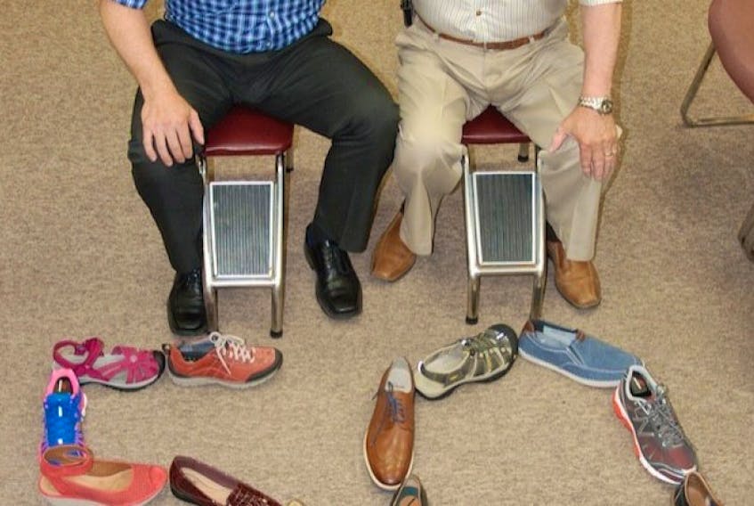 <p><span><span>Wayne Proude, right, and his son Kevin are proud to see the family run shoe business reach the 50-year milestone.</span></span></p>