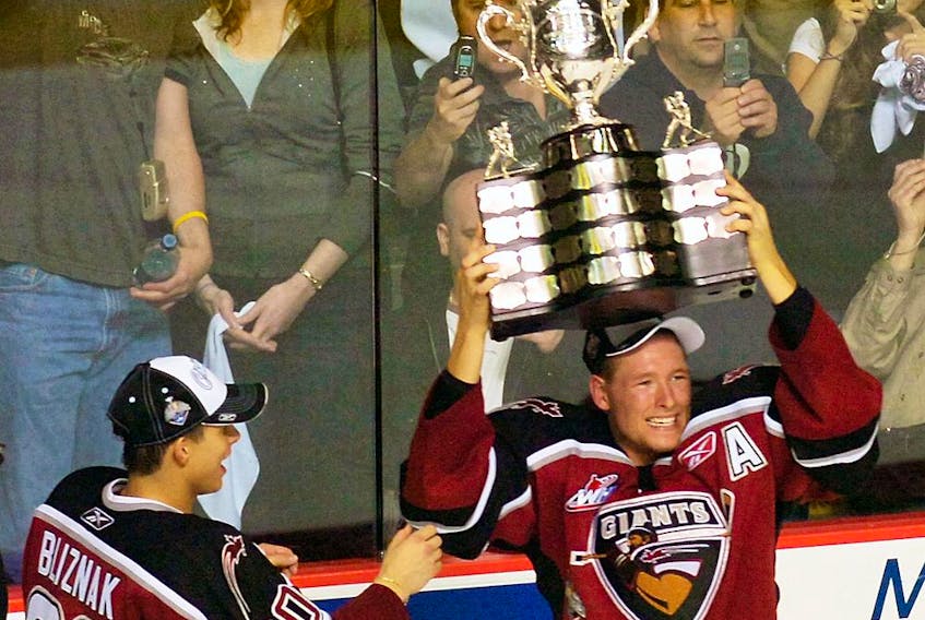 Former Vancouver Giant J.D. Watt hoists the Memorial Cup after his WHL team beat the Medicine Hat Tigers 3-1 in the 2007 Memorial Cup Final at the PNE Coliseum in Vancouver.