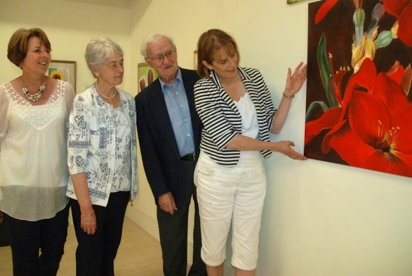<p>(From left) Rhoda Jacquard, Imelda Currans, Father Maurice LeBlanc and Simone d’Eon at the Art Gallery of Nova Scotia’s western branch. The four are among the 10 painters with work on display as part of an exhibit at the AGNS in Yarmouth.<br />ERIC BOURQUE PHOTO</p>