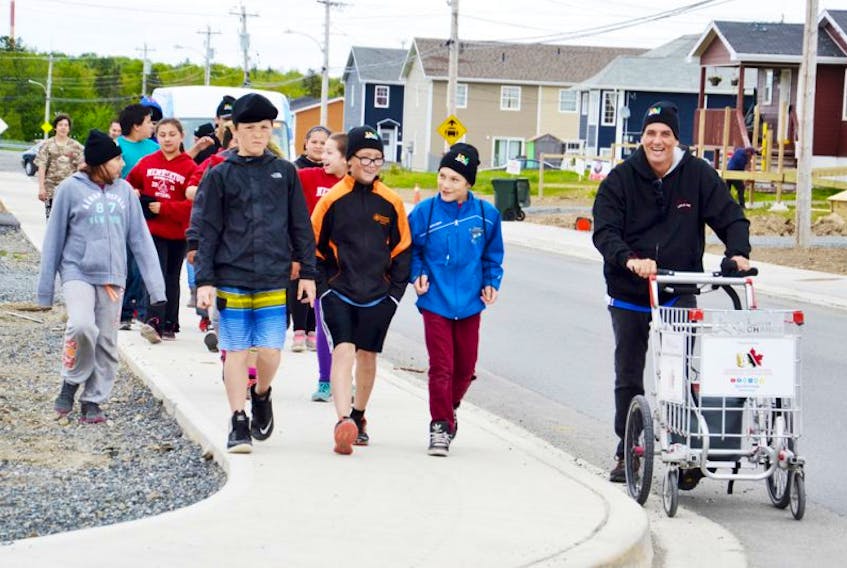 <p>Push for Change campaign executive director Joe Roberts, right, was joined by Grade 6 and 7 students from Membertou earlier this month.</p>
<div>&nbsp;</div>