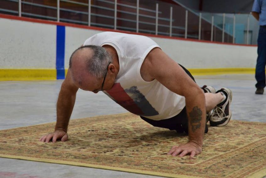 <p>William Guiney did 2,000 pushups Saturday at the Southern Shore Arena in the name of mental health.&nbsp;&nbsp;</p>