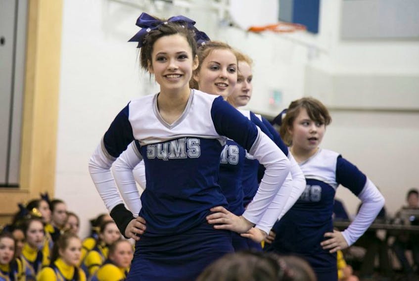 A cheerleader grins during the team’s performance. 