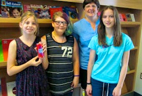Anna Marche, 11, Tamara Uhlman, 12, and Grace Molter, 12, were inspired by their health teacher Sonya Cook when she did a class on the dangers of energy drinks. So they decided to take it one step further – on their own initiative they successfully purchased energy drinks and researched the dangers.