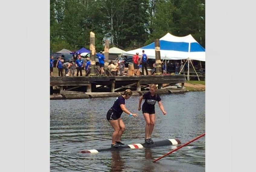 Ella Stevens, left, competes at the Lumberjack World Championships in Hayward, Wis. from July 20 to 22.