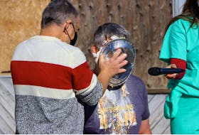 Premier Stephen McNeil takes a pie to the face in Middleton, compliments of Inclusive Opportunities Association vice president Donnie Maclean in October 2020. – Adrian Johnston file photo
