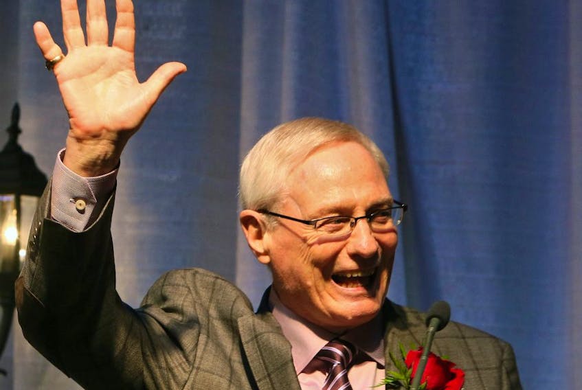 Former NHL Player and legendary Edmonton Oilers (WHA) hockey player, Oiler Assistant GM that won 5-Stanley Cups, Bruce MacGregor, smiles and waves to the crowd before making his speech at the 2015 Alberta Sports Hall of Fame induction gala in Red Deer on Friday, May 29, 2015. 