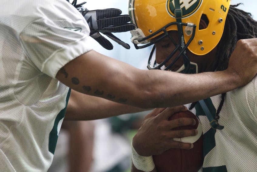 Slotback Fred Stamps works through a drill on the first day of his last Edmonton Eskimos training camp in the field house at Commonwealth Stadium on June 1, 2014.