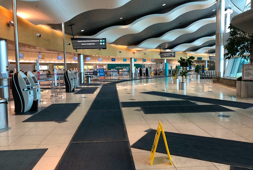The main terminal check-in area at St. John’s International Airport was virtually deserted Wednesday afternoon as worldwide travel plans have affected St. John’s and most other airports across Canada and the United States due to the COVID-19 pandemic. Joe Gibbons/The Telegram
