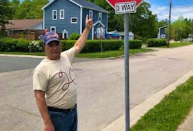 Danny J. Paul points to a street sign in the Ashby neighbourhood of Sydney that did bear the Cornwallis Street sign. A Cape Breton Regional Municipality public works crew removed all nine street signs bearing the 18th-century British general's name on Monday. KAREN RUSHTON-PAUL/FACEBOOK