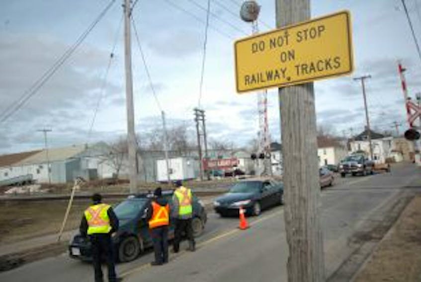 ['Members of Operation Lifesaver, as well as the Truro Police Service, CN Police and Via Rail, were stopping motorists at the railway crossing on Young Street in Truro yesterday morning in a safety blitz aimed at raising awareness. More than 300 collisions occur in Canada each year on railways.&nbsp;']