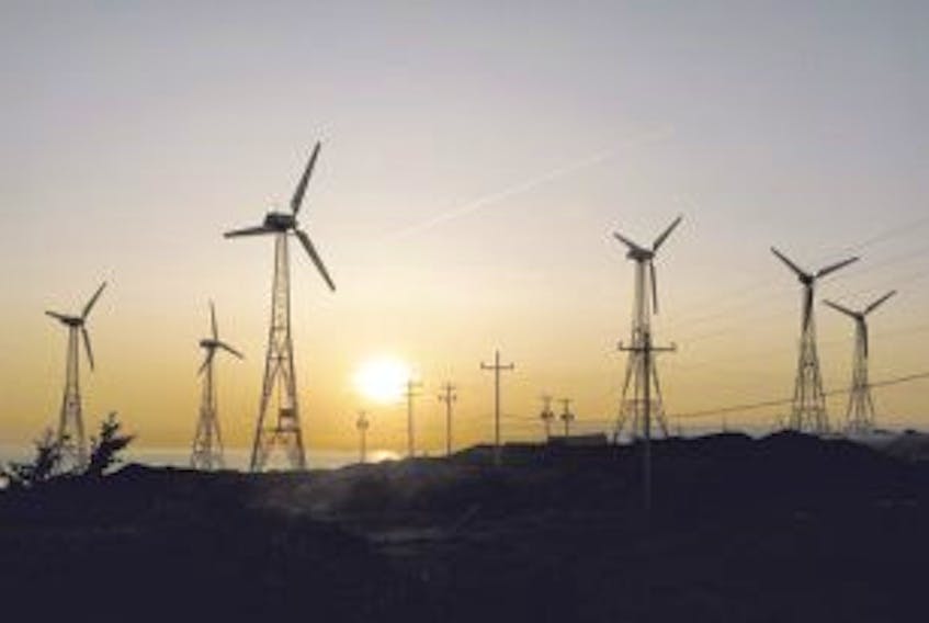['Wind turbines in Ramea are etched against a setting sun. Despite lots of talk about developing wind power in this province, the provincial government has said the Lower Churchill project must be a priority — Telegram file photo']
