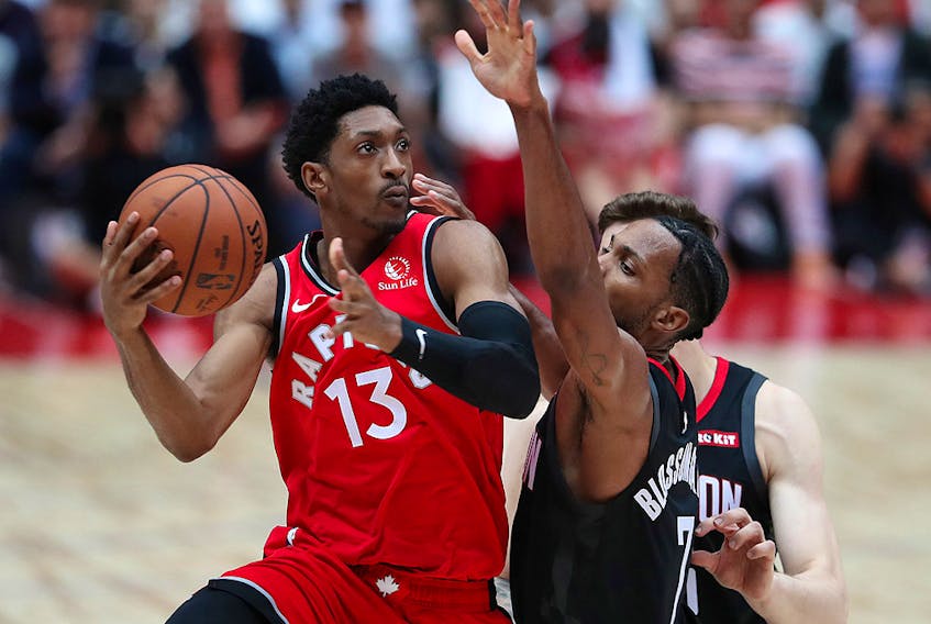 Malcolm Miller of the Toronto Raptors drives to the basket against Jaron Blossomgame of the Houston Rockets during their preseason game at Saitama Super Arena on October 8, 2019 in Saitama, Japan. (Takashi Aoyama/Getty Images)