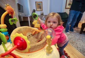 Ivy Stewart plays with a toy in the living room of the Ronald McDonald House in Halifax. The family from Woodstock, New Brunswick, was recently in Halifax for care for their daughter Ivy. Ivy has Mobeius syndrome which affects the muscles in the face.
ERIC WYNNE/Chronicle Herald