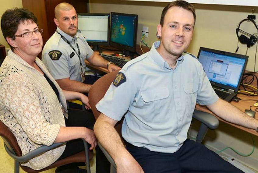 <span>Members of the RCMP involved in a nation-wide investigation into child sexual exploitation are currently reviewing images and videos seized during searches on the Island. From left are Constables Cheryl Duffy, Shannon Hodder and Chris Manuel.</span>