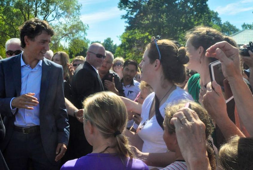 <p>New Minas entrepreneurs Rachel Aalders and Eve Rowsell (white and green shirts) went to Bridgetown on Aug. 15 to talk to a variety of politicians, including the Prime Minister.</p>