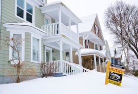 A for sale sign sits on the snow covered front yard of this home on Beacon Street in Sydney. Home sales across the island were strong last year and to start this year in Cape Breton. That trend is expected to continue right across the province for the rest of 2015.<br /><br /><br />