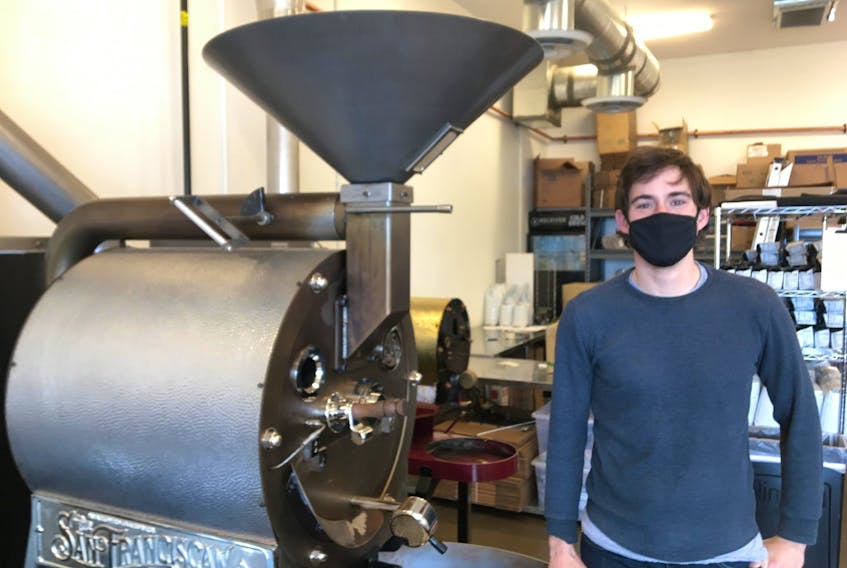 Chris Francis stands in front of his 25-pound roaster at Receiver Coffee Company's location at the North River Causeway in Charlottetown. Francis started roasting coffee in 2010.