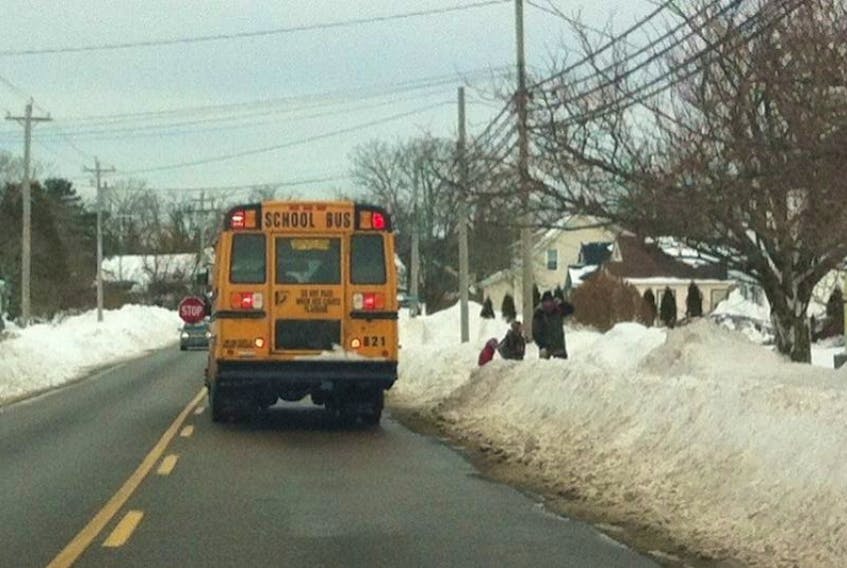 When red lights are activated on school buses, motorists must stop.