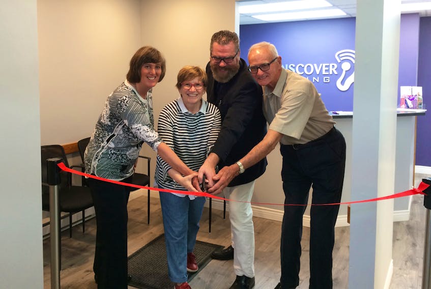 Town of Antigonish mayor Laurie Boucher joined owner Sarah MacDonald, as well as her husband and father, for the ribbon-cutting ceremony during the grand opening celebration June 6. Debbie Grant