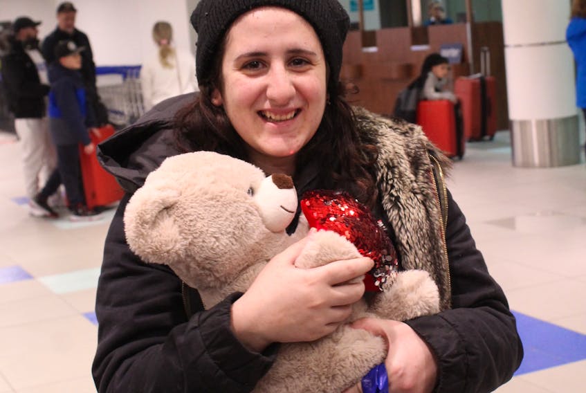Ninar Shahoud smiles proudly with her new bear with a heart symbolizing the HEART Society after arriving with her family at Halifax Stanfield Airport on Feb. 10. The family will be calling Elmsdale home.