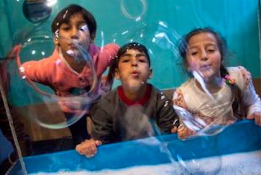 ['Syrian refugee children (left to right) Raghed Diab, Ibrahim Al Nasan, Shady Al Masalmy and Shahd Al Nasan play at the bubble room at the Discovery Centre in downtown Halifax during a field trip there Wednesday. &nbsp; &nbsp;']