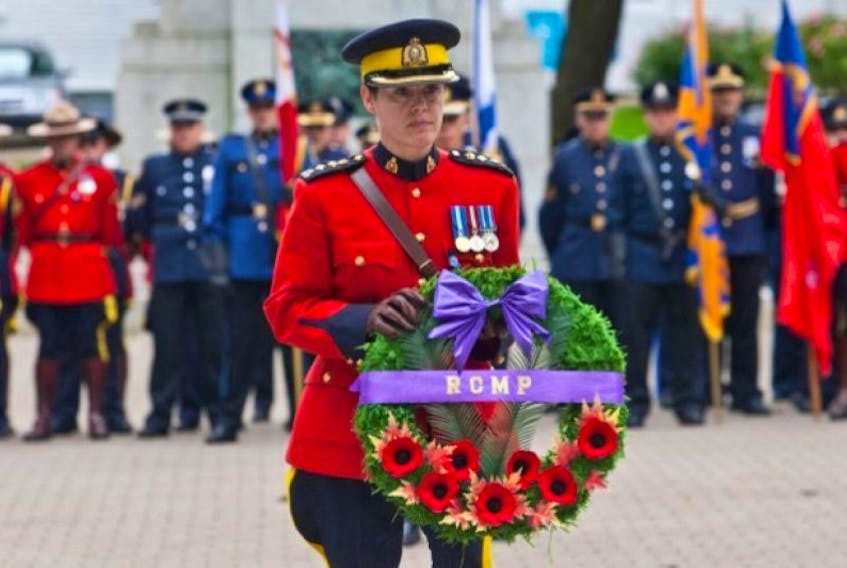 RCMP Superintendent Marlene Snowman prepares to lay a wreath at Grand Parade on behalf of all fallen RCMP officers in Nova Scotia Oct. 19