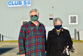Louie Hawco, left, and Elizabeth Mahoney stand in the side parking lot of Club 55. The parking lot is now under dispute with the Cape Breton Regional Municipality. ELIZABETH PATTERSON/CAPE BRETON POST