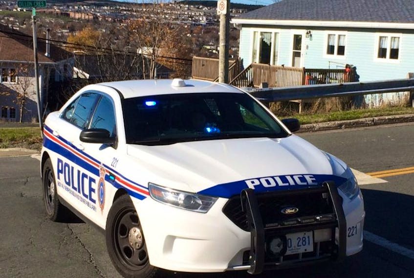 A Royal Newfoundland Constabulary patrol car is blocking off Dillon Crescent at the intersection of Linegar Avenue, where there are reports of an armed standoff and barricaded person in a home in the Shea Heights area of St. John's. — Photo by Joe Gibbons/The Telegram