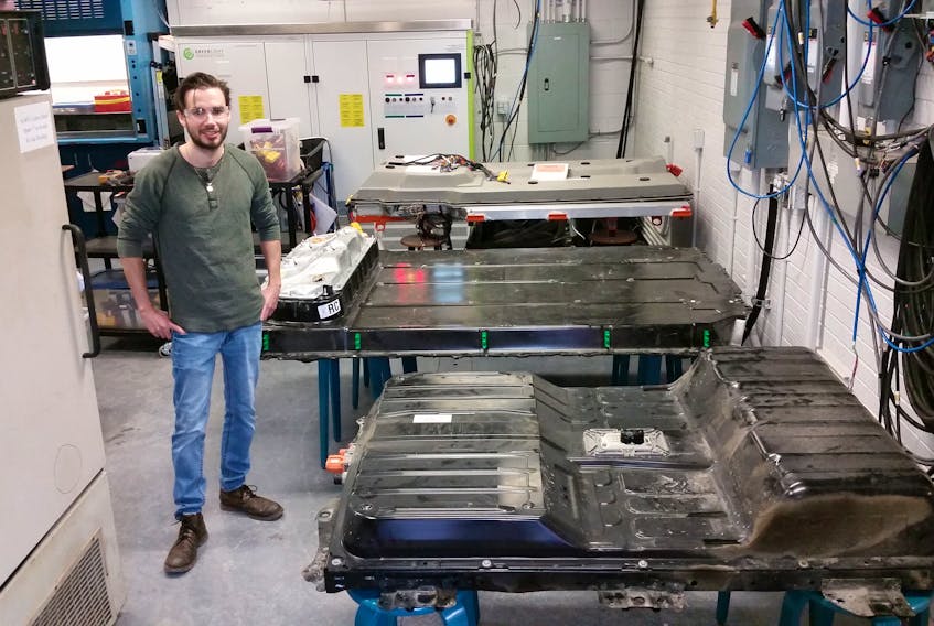 Dalhousie engineering PhD candidate Chris White, shown in the Renewable Energy Storage lab at Dal, is working on a way to incorporate used electric vehicle batteries into power grid systems as a means to possibly supplement a future based on renewable energy.
