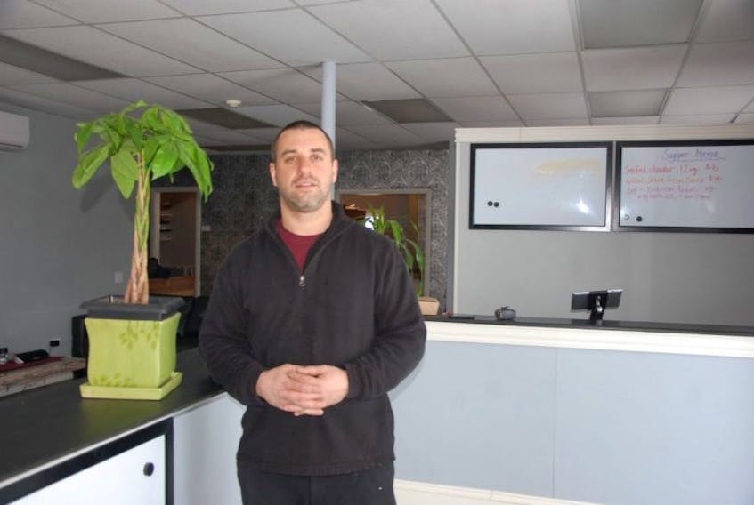 <p>Jonathan Vickerson stands inside his new restaurant at 24 Central St. in Summerside. Vickerson is putting the finishing touches to the 12-seat-at in/take-=out restaurant. The project was delayed over an issue of whether the project needed the approval of an architect or an engineer.&nbsp;</p>
