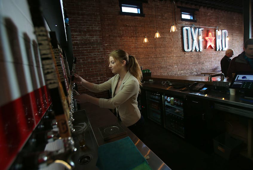 Diana Lewis, Garrison Brewing's marketing and events co-ordinator, pours a sampler at the Oxford, formerly part of the old Oxford Theatre, in Halifax last November. The taproom will be the first location to get Draught Pro Certified.
TIM KROCHAK The Chronicle Herald 