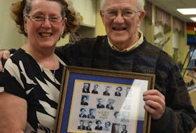 Reunion chairperson Wendy Rodda presents former principal Al Peppard with a framed photo of the first teaching staff at Middleton Regional High School. The school is marking the 70th anniversary of the first graduating class, and Peppard has been along for the whole ride. HEATHER KILLEN