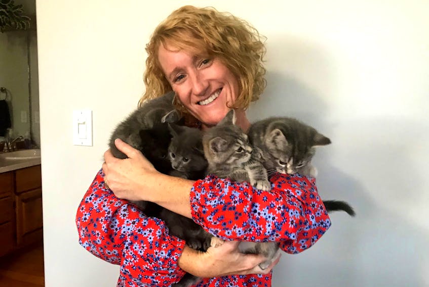 Bobbi-Jo Reardon of Rice Point says being a foster family for the P.E.I. Humane Society is a lot of work, but she wouldn't trade these cuddles for the world.