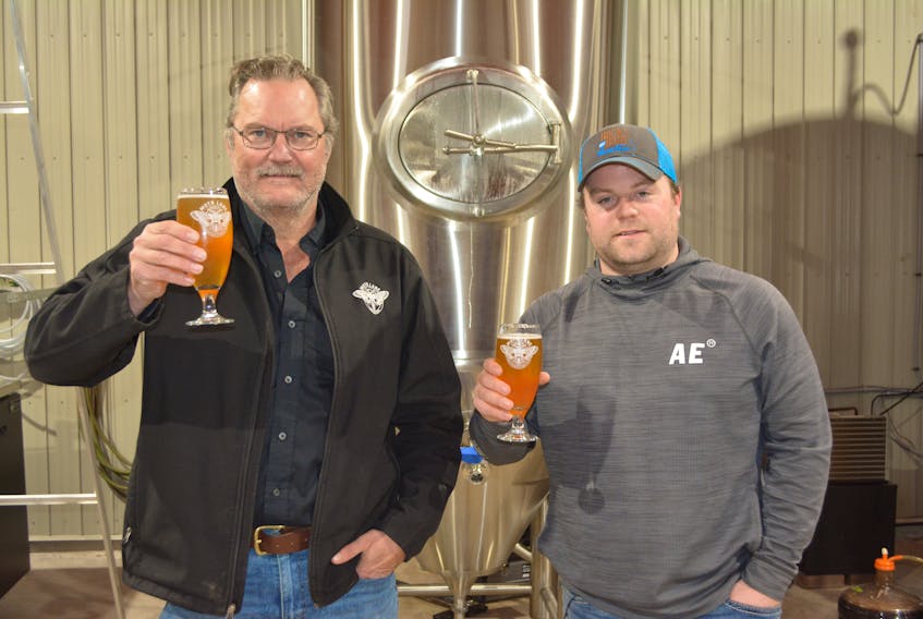 Moth Lane Brewing owner, Eric Wagner, left, and Adam MacLennan, chairman of the Tyne Valley and Area Community Sports Centre’s rebuilding fund prepare to sample Wagner’s latest limited-edition Rink Rat craft beer. Wagner is donating all the proceeds from the sale of the kegs the batch produced to the rebuilding fund.
Eric McCarthy/Journal Pioneer
