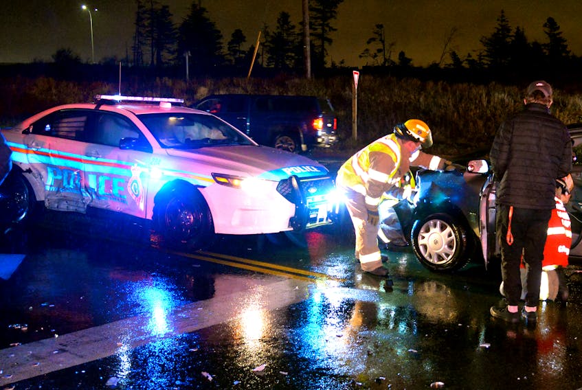 An RNC officer was treated for minor injuries after a car collided with his cruiser Friday night. Keith Gosse/The Telegram