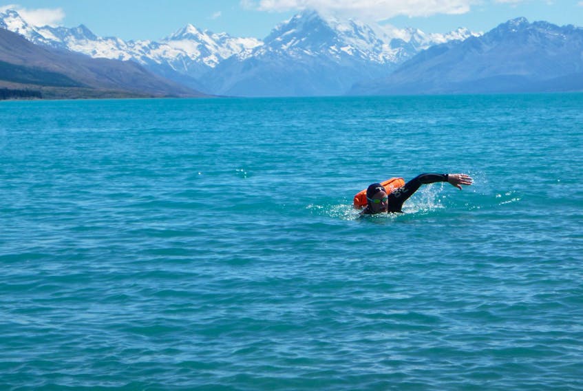 Rob Hutchings is shown swimming Lake Puakaki in New Zealand. CONTRIBUTED