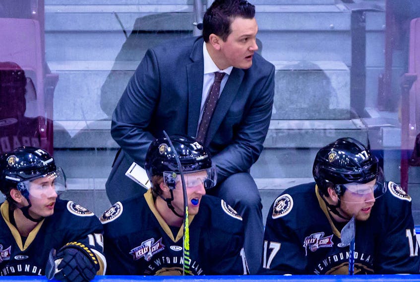 Newfoundland Growlers head coach John Snowden is shown on the bench during an ECHL a game at Mile One Centre earlier this season, There are plenty of instances of coaches moving up from the ECHL to eventually take top jobs with National Hockey League teams, but it seems the majority of NHL vacancies are filled by faces that are familiar behind big-league benches. — Newfoundland Growlers photo/Jeff Parsons